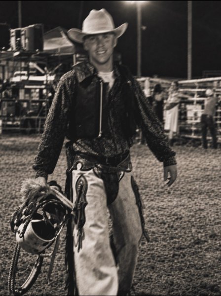Christopher wearing a cowboy hat and rodeo chaps